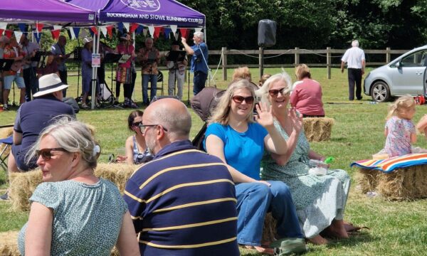 people sat on straw bales